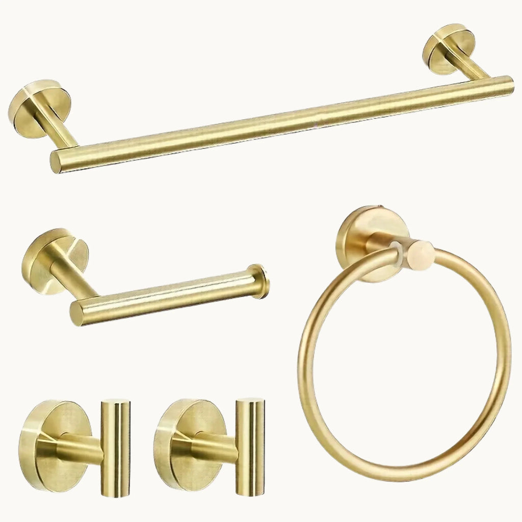 Modern gold bathroom hardware set with towel bar, towel ring, hooks, and toilet paper holder
