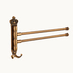 Vintage brass wall mounted towel rack with two swivel bars and decorative crown design