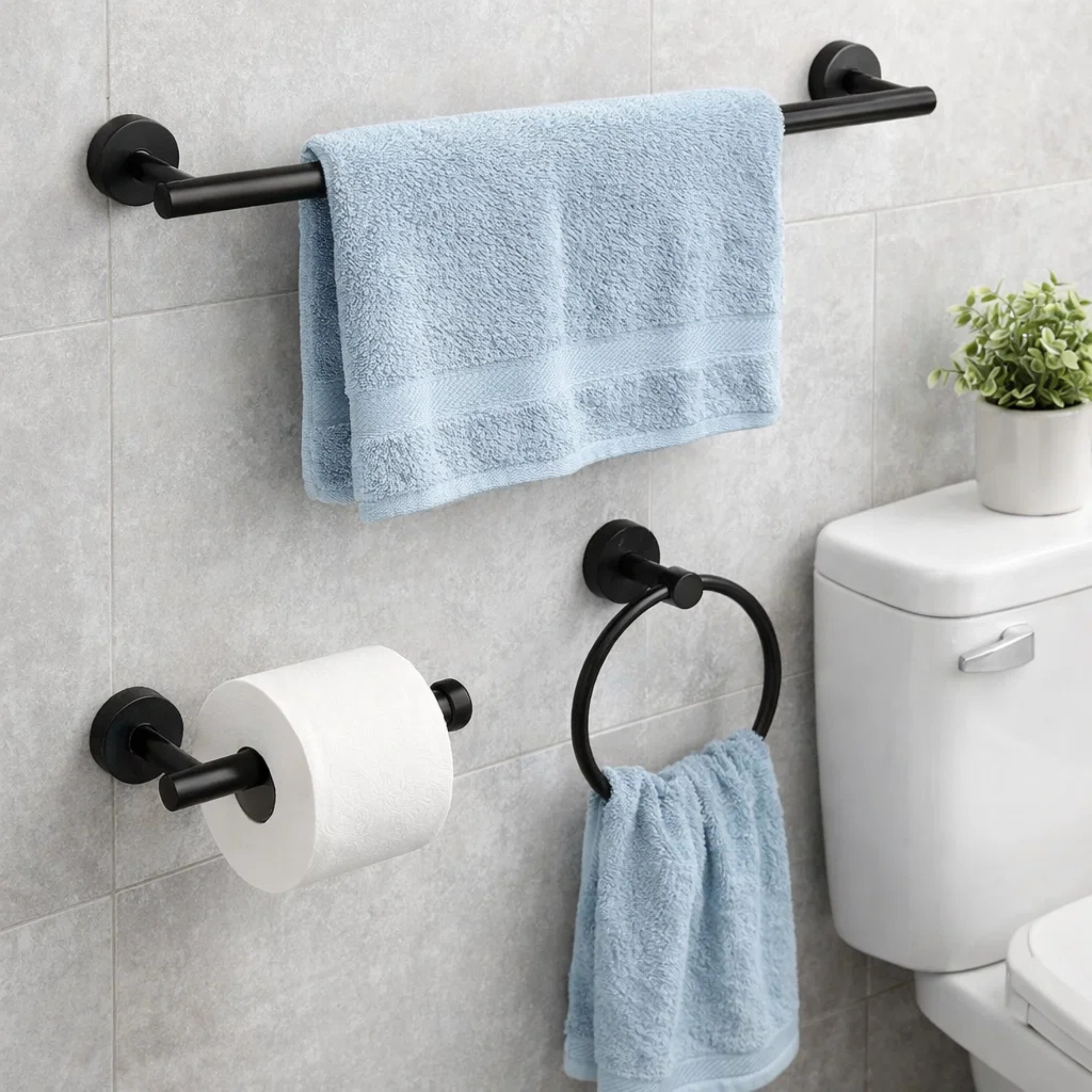 Modern bathroom with black wall mounted towel bar, towel ring, and toilet paper holder
